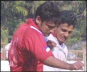 Maharashtra's Mir Farooq Hyder (left) and Railways Amrit Raja battle for possession.